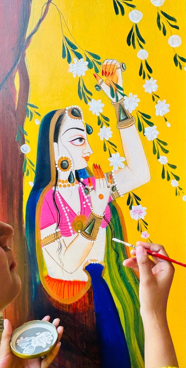 Artisan painting traditional Basohli miniature art